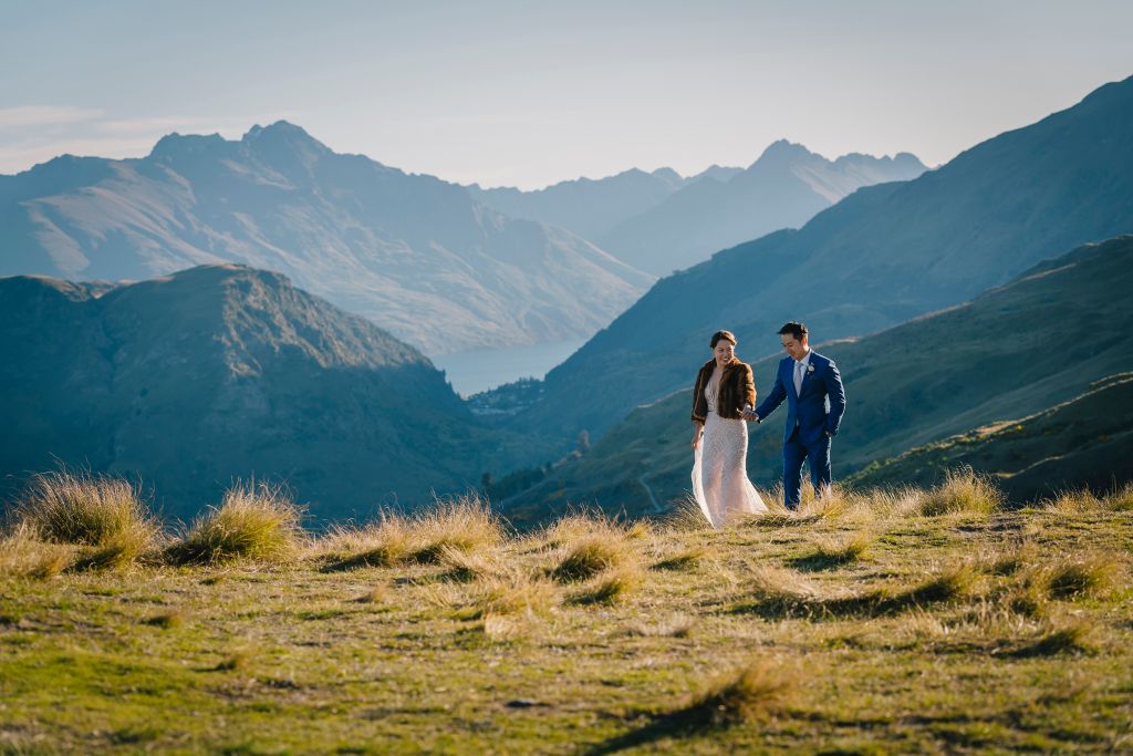 Wedding couple embracing by the lake - Queenstown Wedding Packages